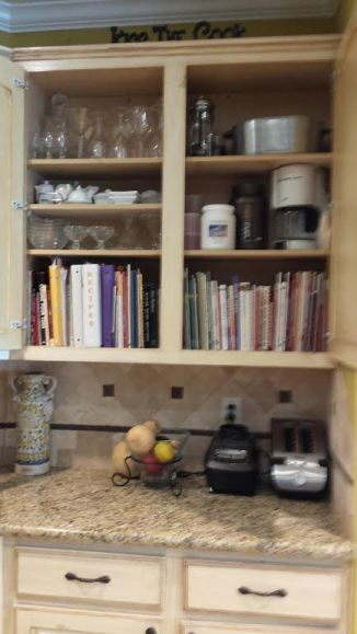 Upper cabinet 3 AFTER The cookbooks are accessible and the other cabinets are grouped together by similar function.
